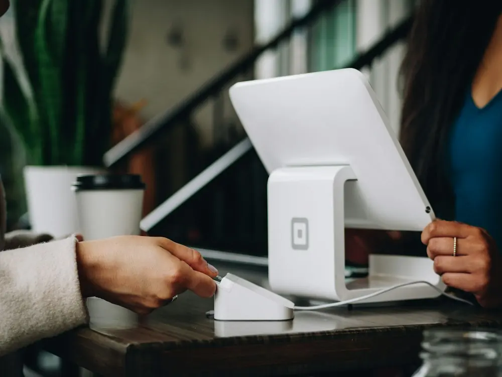 Business owner taking a customer payment