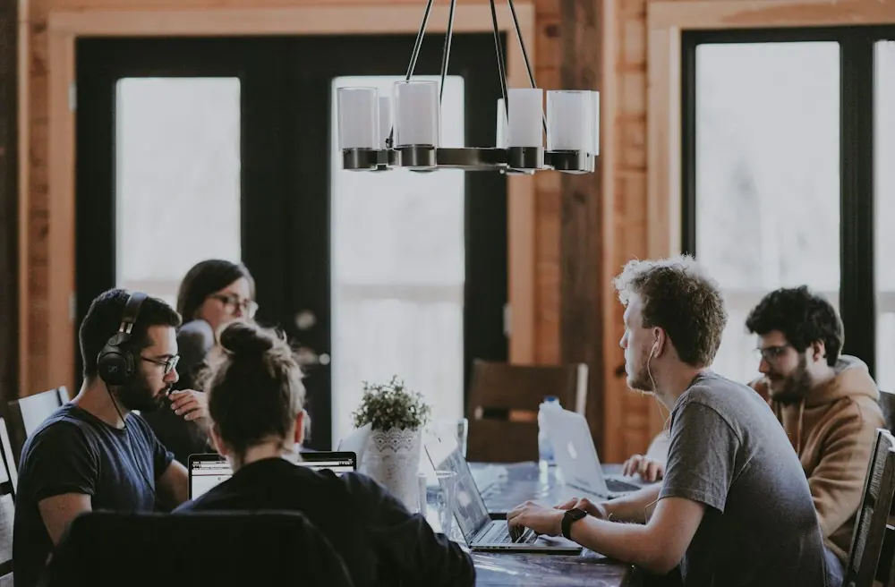 Agency team meeting around a table