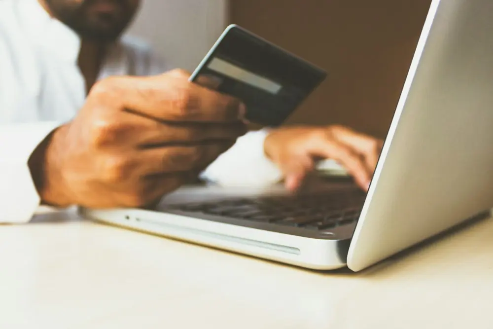 Online payment made with a card on a laptop